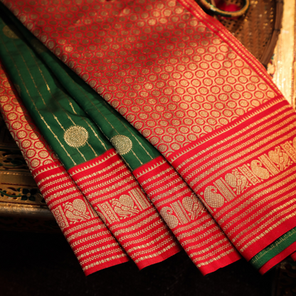 Luxurious red Katan Silk Saree with golden border


